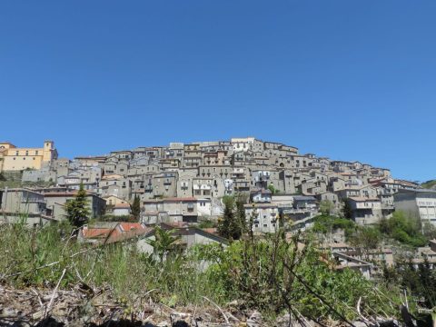 Panoramic view of the hilltop village of Castelgrande in Basilicata with terraced buildings
