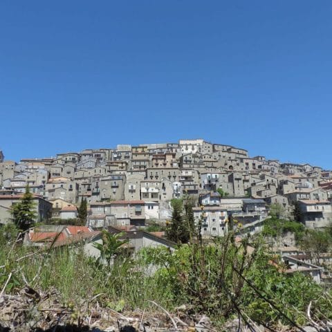 Panoramic view of the hilltop village of Castelgrande in Basilicata with terraced buildings