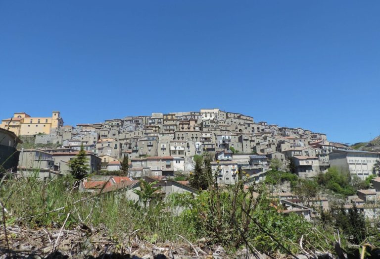 Panoramic view of the hilltop village of Castelgrande in Basilicata with terraced buildings