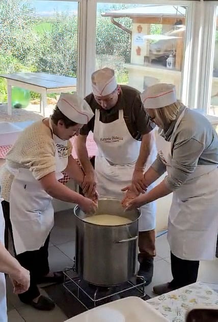 Guests making cheese together at a farm in Chianti