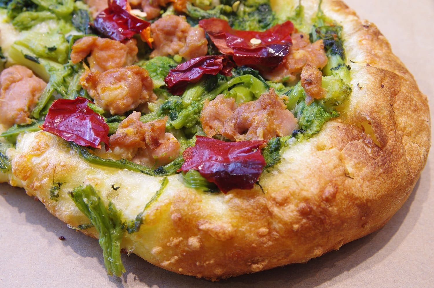 Topped focaccia with greens and peppers from Il Forno di Gennaro