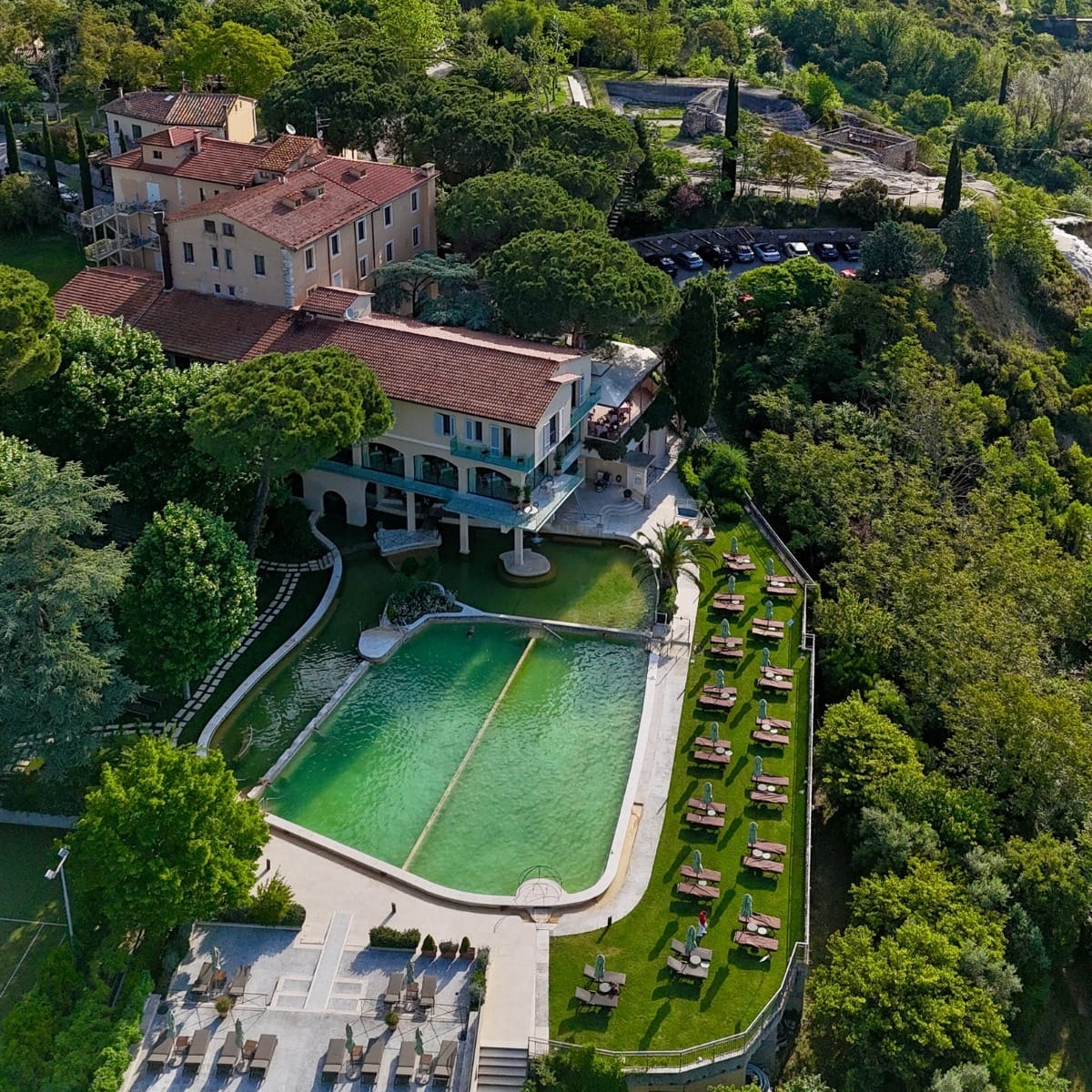 Aerial view of Hotel La Posta and its thermal pools in Bagno Vignoni