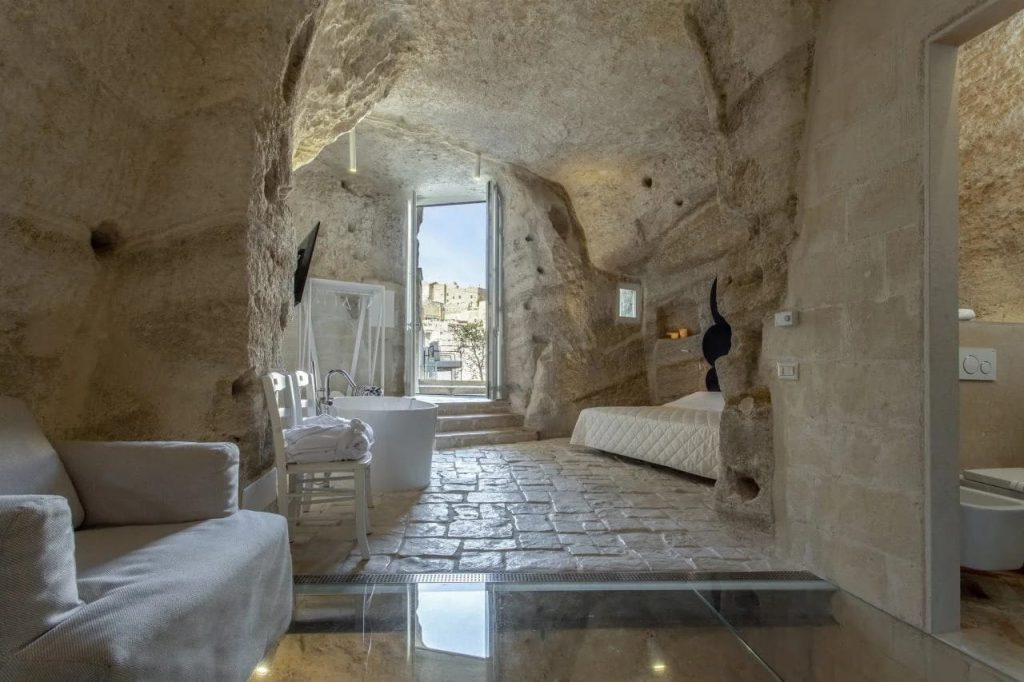 Suite room at Dimore dell'Idris carved into the rock with stone floor and open doorway