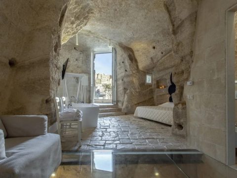 Suite room at Dimore dell'Idris carved into the rock with stone floor and open doorway