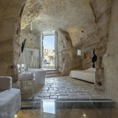 Suite room at Dimore dell'Idris carved into the rock with stone floor and open doorway