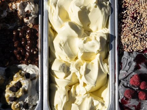 Artisan gelato in metal trays at Gelateria Caruso in Castelmezzano