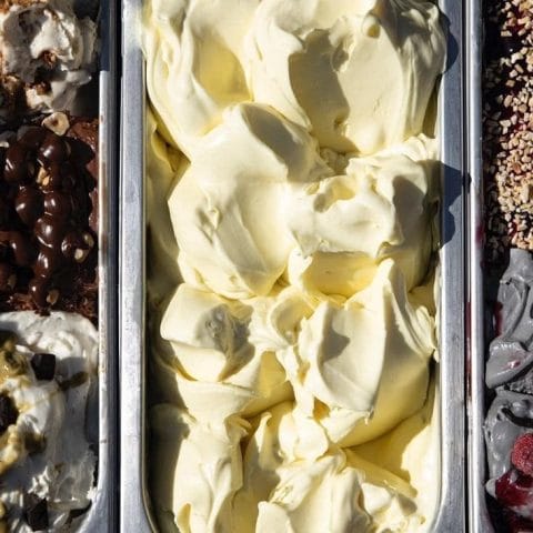 Artisan gelato in metal trays at Gelateria Caruso in Castelmezzano