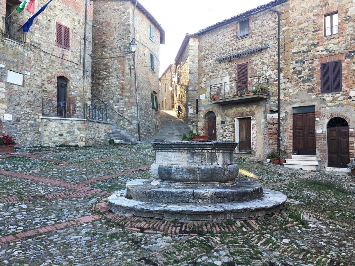 The triangular Piazza il Vecchietta with its travertine well