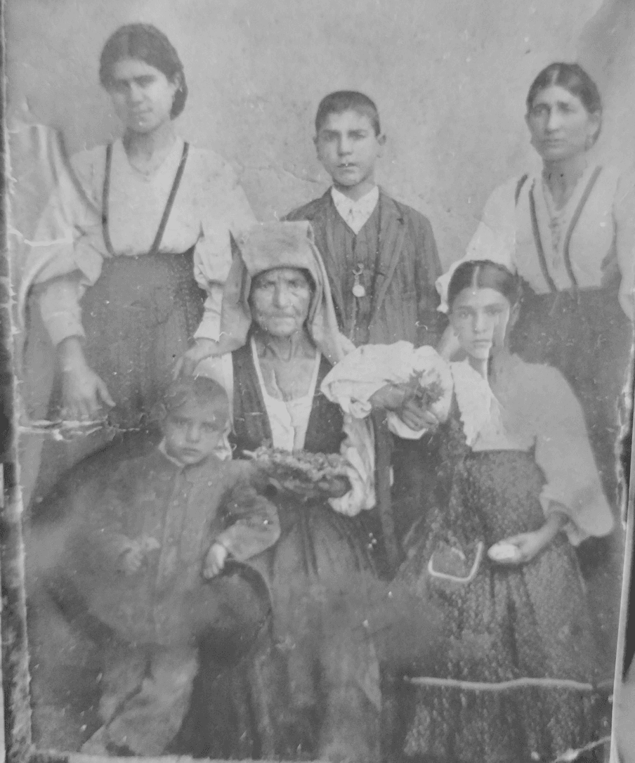Family photo taken approximately 1910, featuring Pasqua Sardella and Anna Maria D'Alessandro in traditional Pacchiana dress