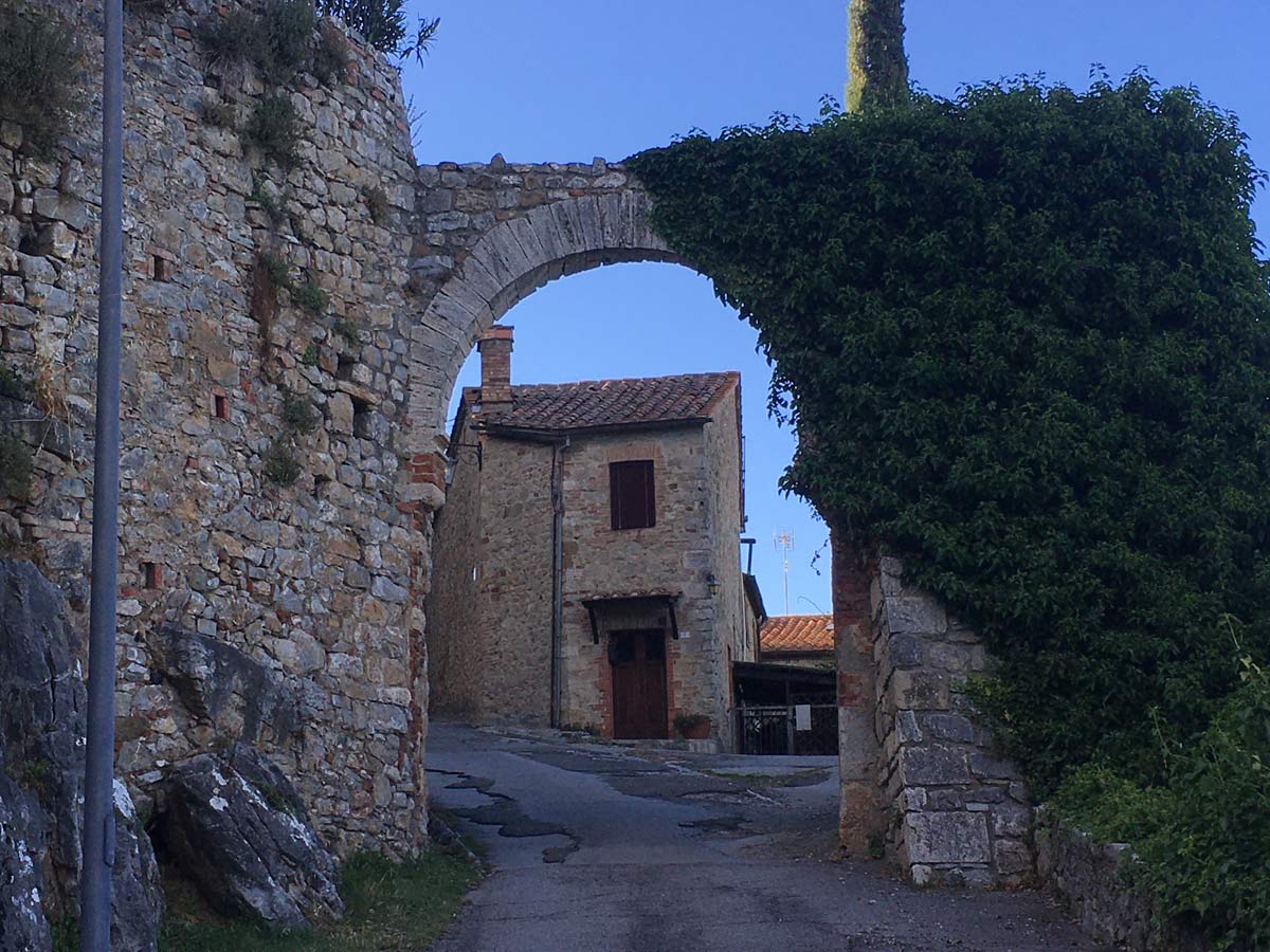 Medieval gateway leading to Rocca d'Orcia