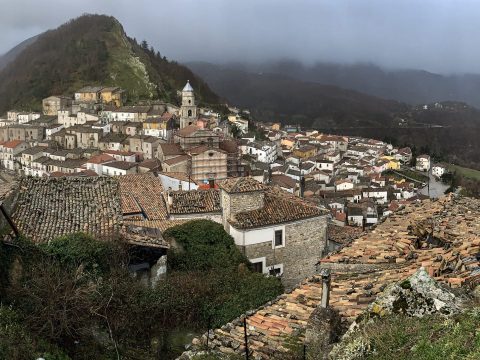 Panoramic view of San Fele village between two mountains in the Vulture region
