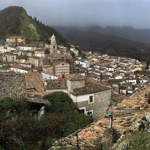 Panoramic view of San Fele village between two mountains in the Vulture region
