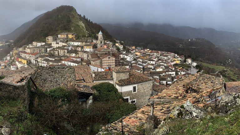 Panoramic view of San Fele village between two mountains in the Vulture region