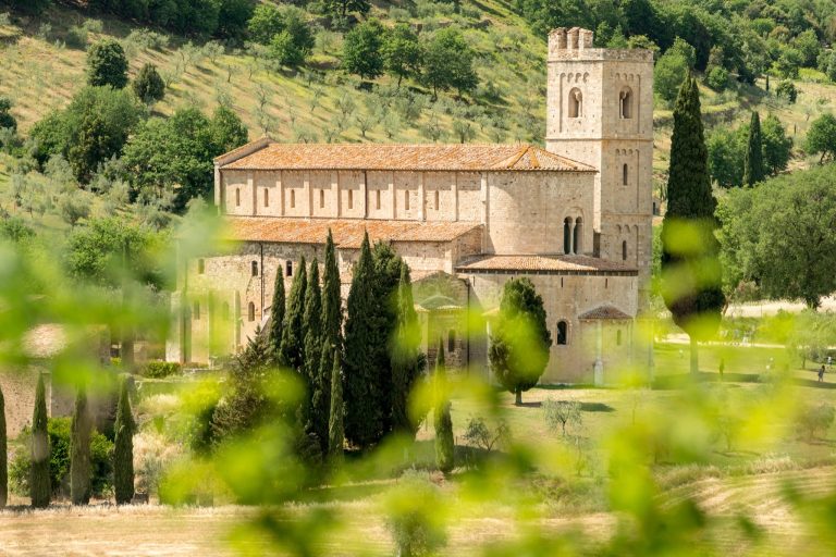 The Romanesque Abbey of Sant'Antimo set in olive groves near Montalcino