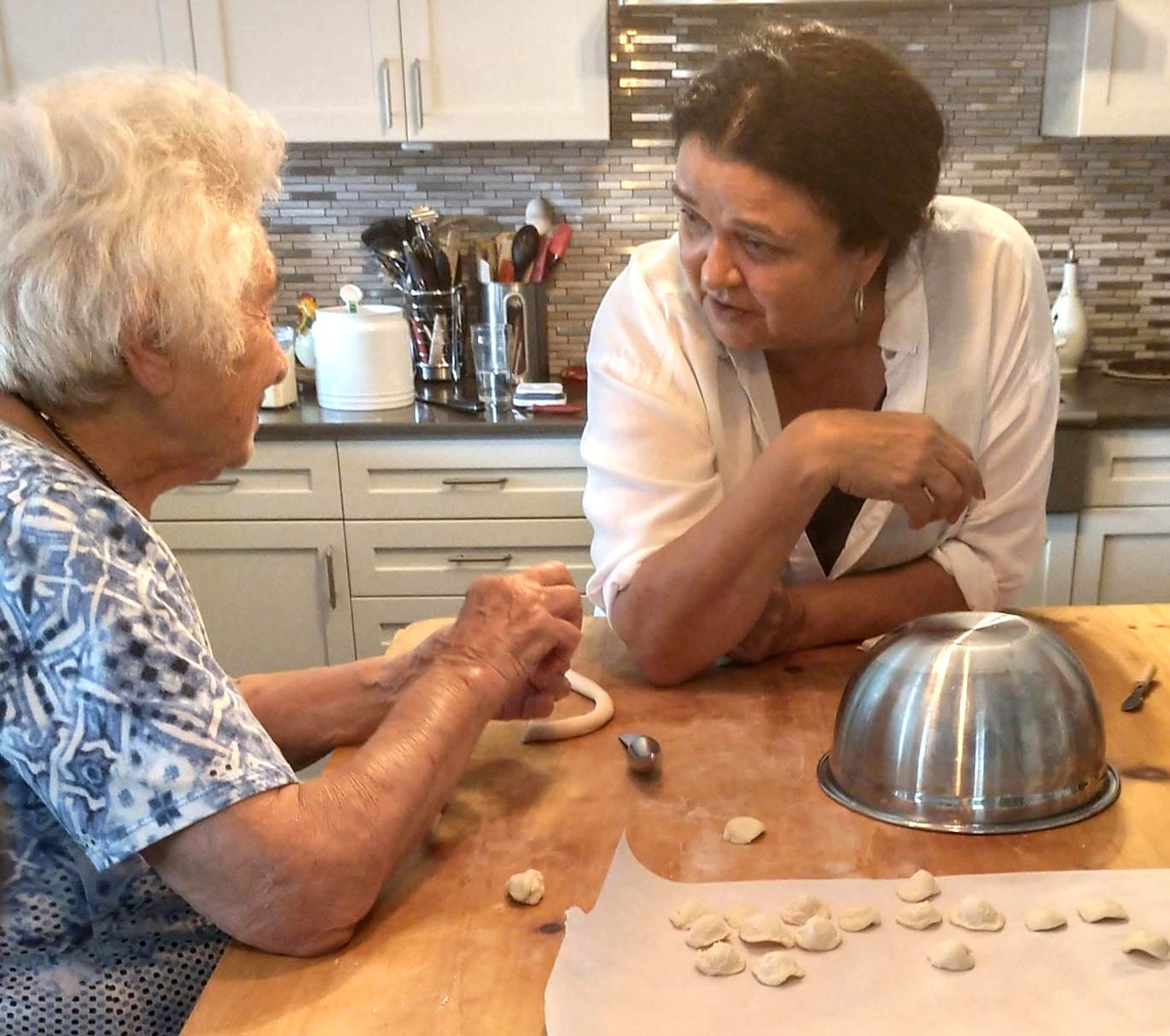Anna and Adele making taralli at the kitchen table