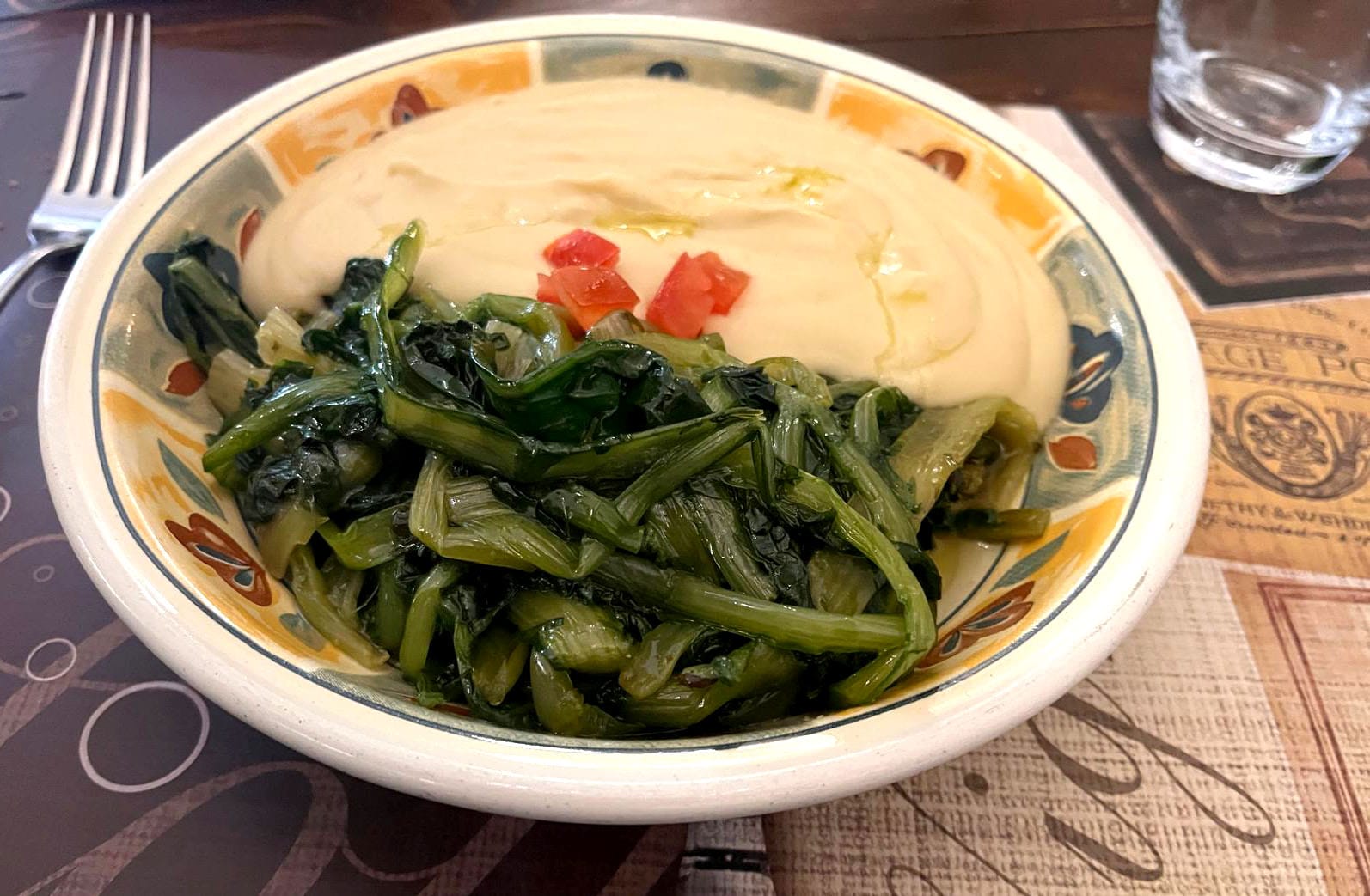 Braised dandelion greens beside a fava bean purée
