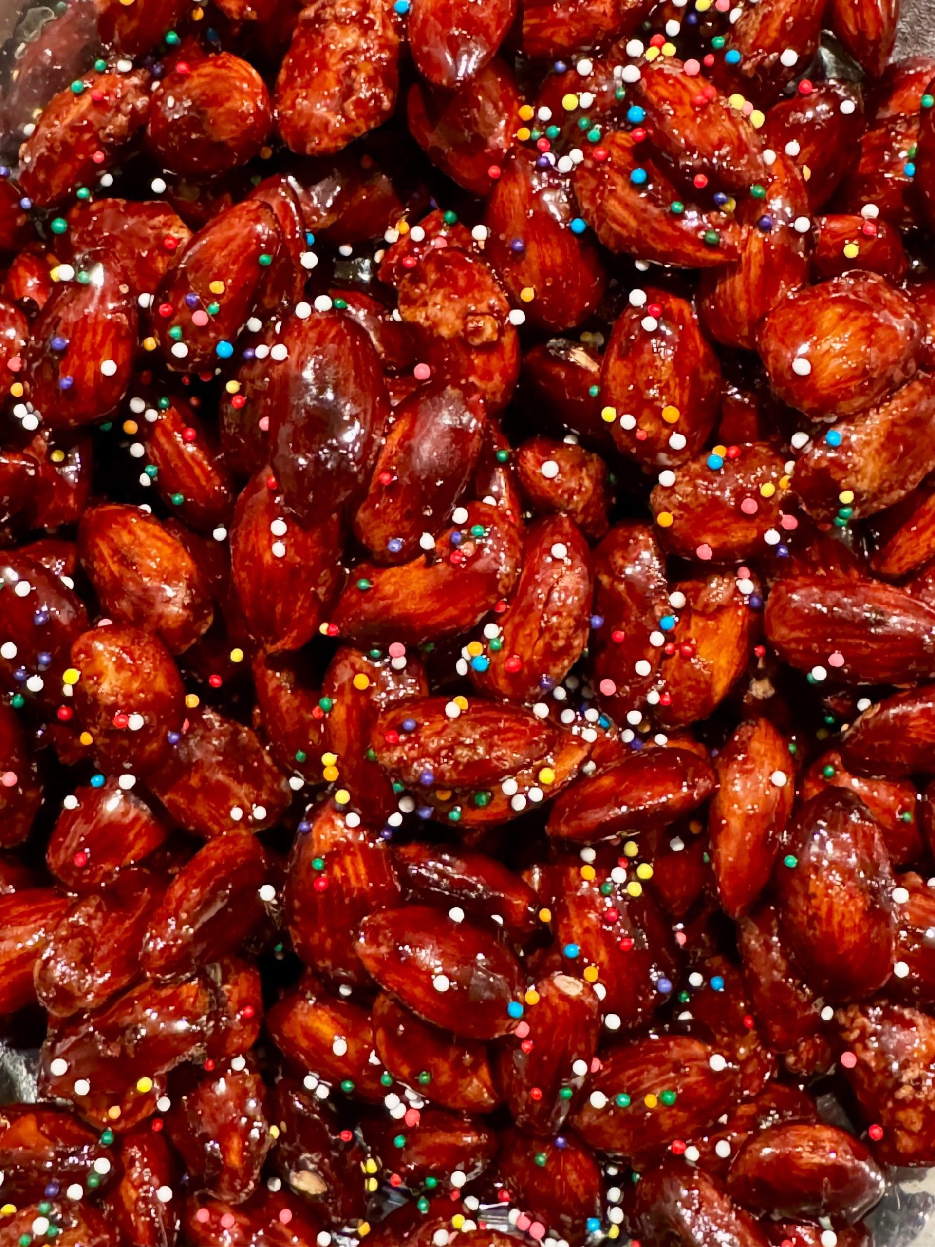 Torrone di mandorle — glazed almonds scattered with colorful candy sprinkles