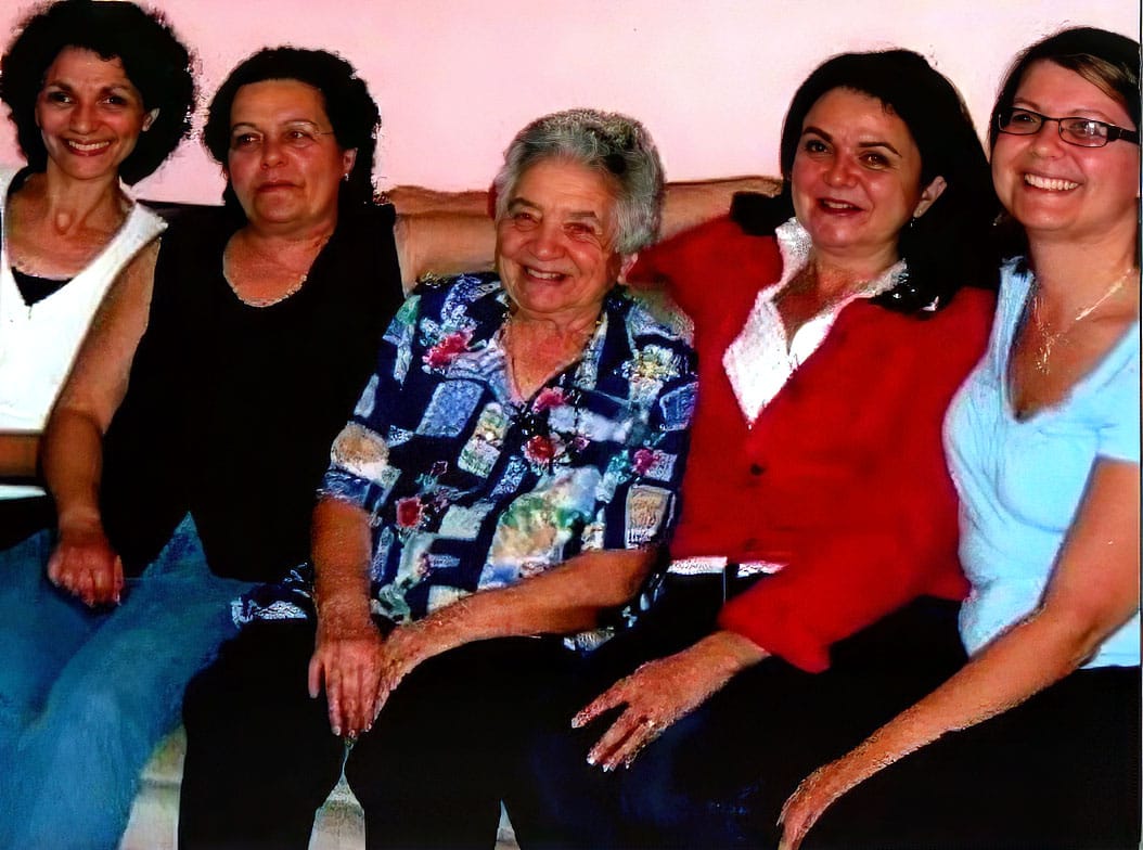 Anna seated with her four daughters