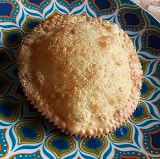 Seadas, fried semolina pastries drizzled with honey